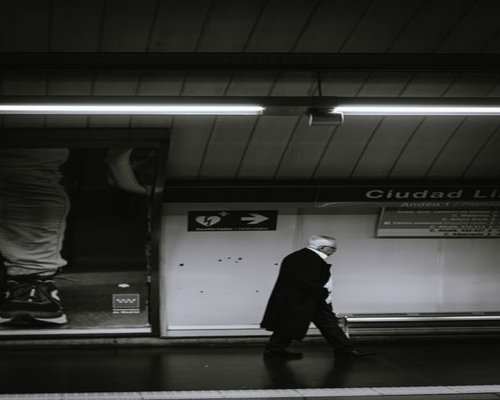 Commuter walking comfortably towards a metro station in Madrid