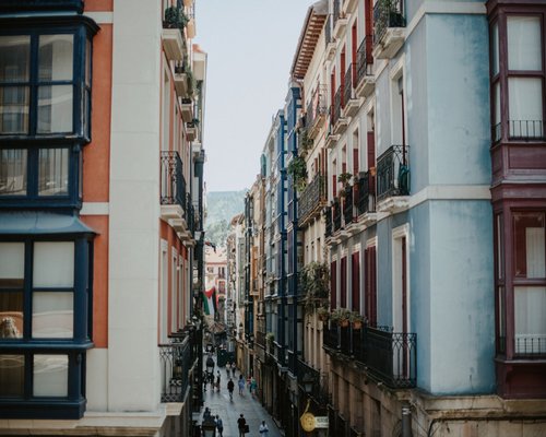 Person doing light chores and organizing a bright Spanish apartment