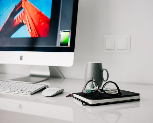 Person stretching lightly at a modern home office desk