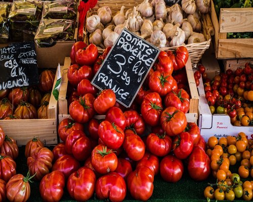 People walking calmly through a local outdoor market in Valencia